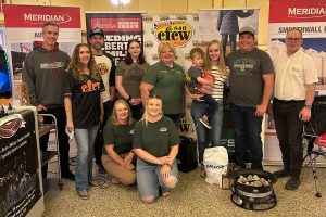 A group of people pose with the portable fire bowl.