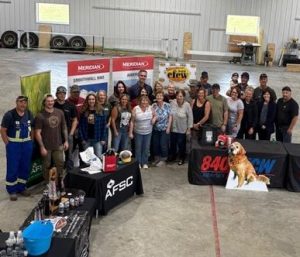 A group of people pose for a photo
